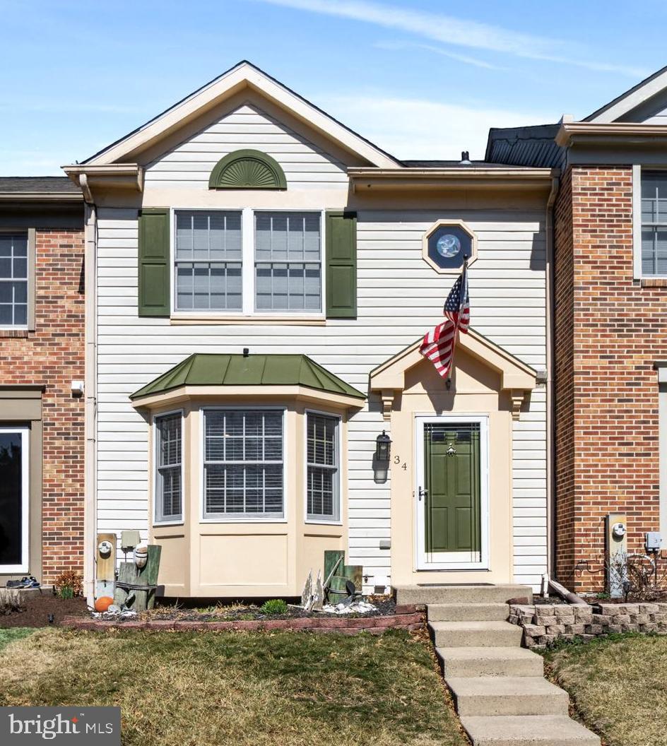 34 Margery Court Baltimore, MD 21236 - Photo 1 of 1 a front view of a house with a yard