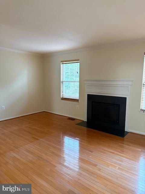 6358 Shaundale Drive Springfield, VA 22152 - Photo 12 of 54 a view of empty room with wooden floor and fireplace