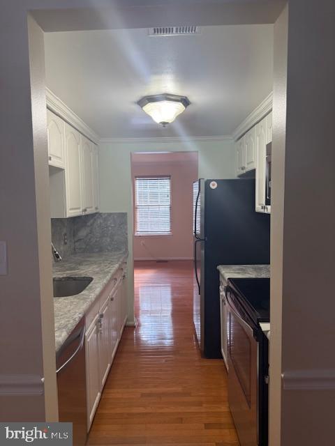 6358 Shaundale Drive Springfield, VA 22152 - Photo 20 of 54 a kitchen with granite countertop a refrigerator and a sink