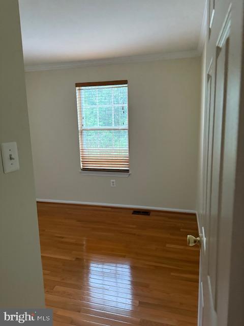 6358 Shaundale Drive Springfield, VA 22152 - Photo 25 of 54 an empty room with wooden floor and windows