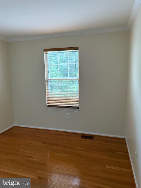 6358 Shaundale Drive Springfield, VA 22152 - Photo 27 of 54 an empty room with wooden floor and windows