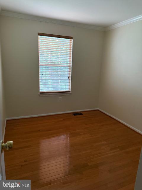 6358 Shaundale Drive Springfield, VA 22152 - Photo 29 of 54 a view of an empty room with wooden floor and a window
