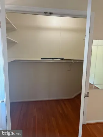 a white toilet sitting next to a small bathroom