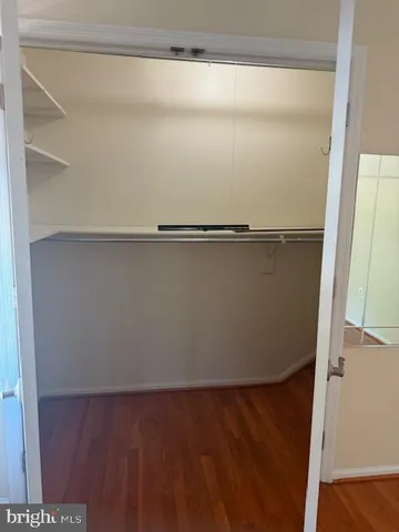 a white toilet sitting next to a small bathroom