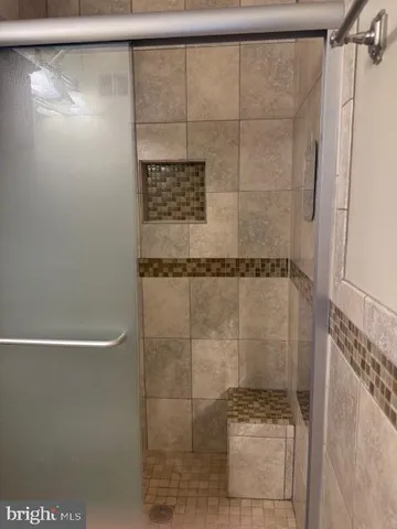 a bathroom with a sink toilet and mirror