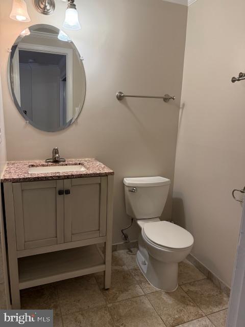 6358 Shaundale Drive Springfield, VA 22152 - Photo 49 of 54 a bathroom with a toilet a sink and mirror