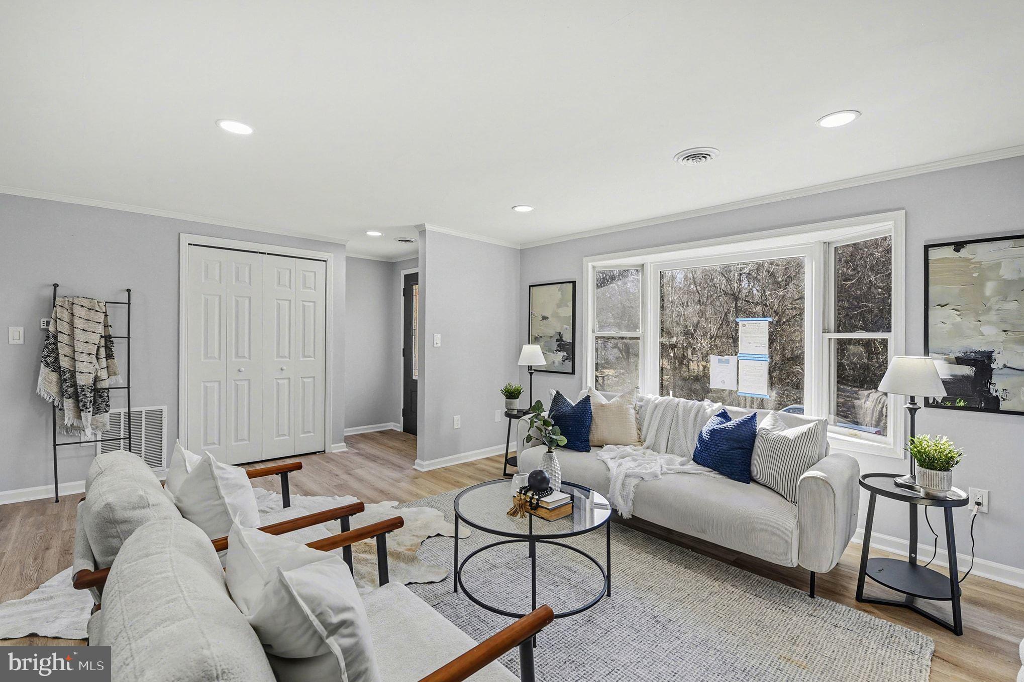 1009 Maple Road Essex, MD 21221 - Photo 11 of 26 a living room with furniture and a large window