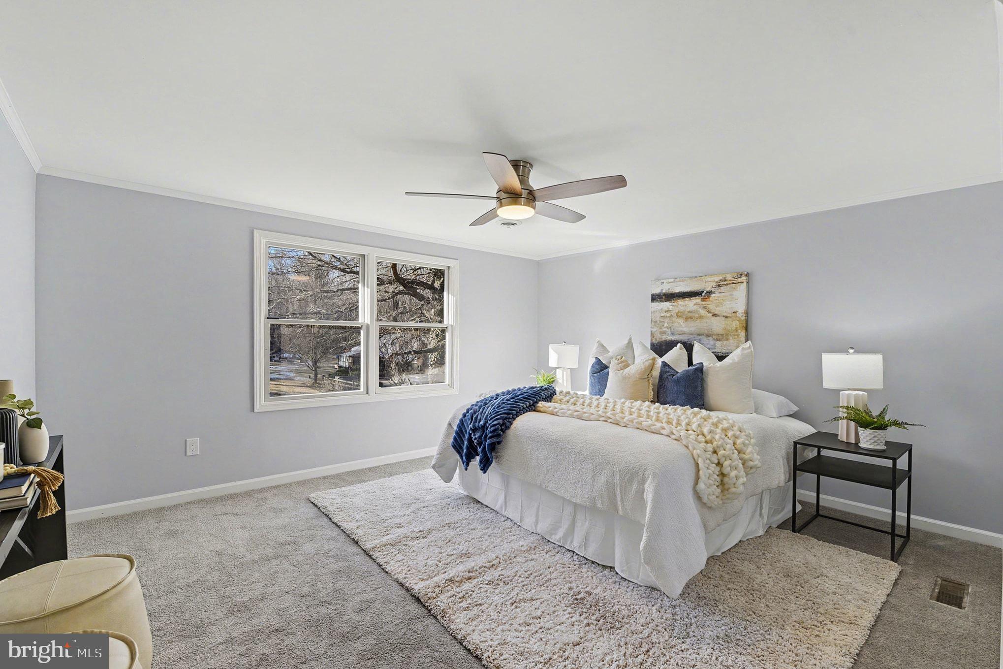 1009 Maple Road Essex, MD 21221 - Photo 12 of 26 a bedroom with a bed and a window