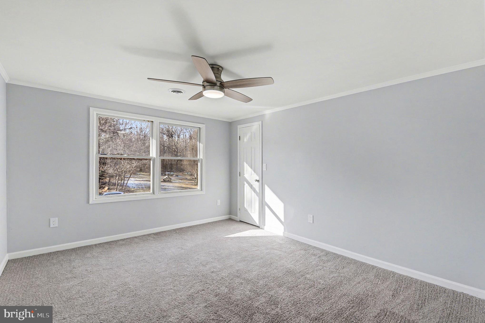 1009 Maple Road Essex, MD 21221 - Photo 17 of 26 a view of an empty room with a window