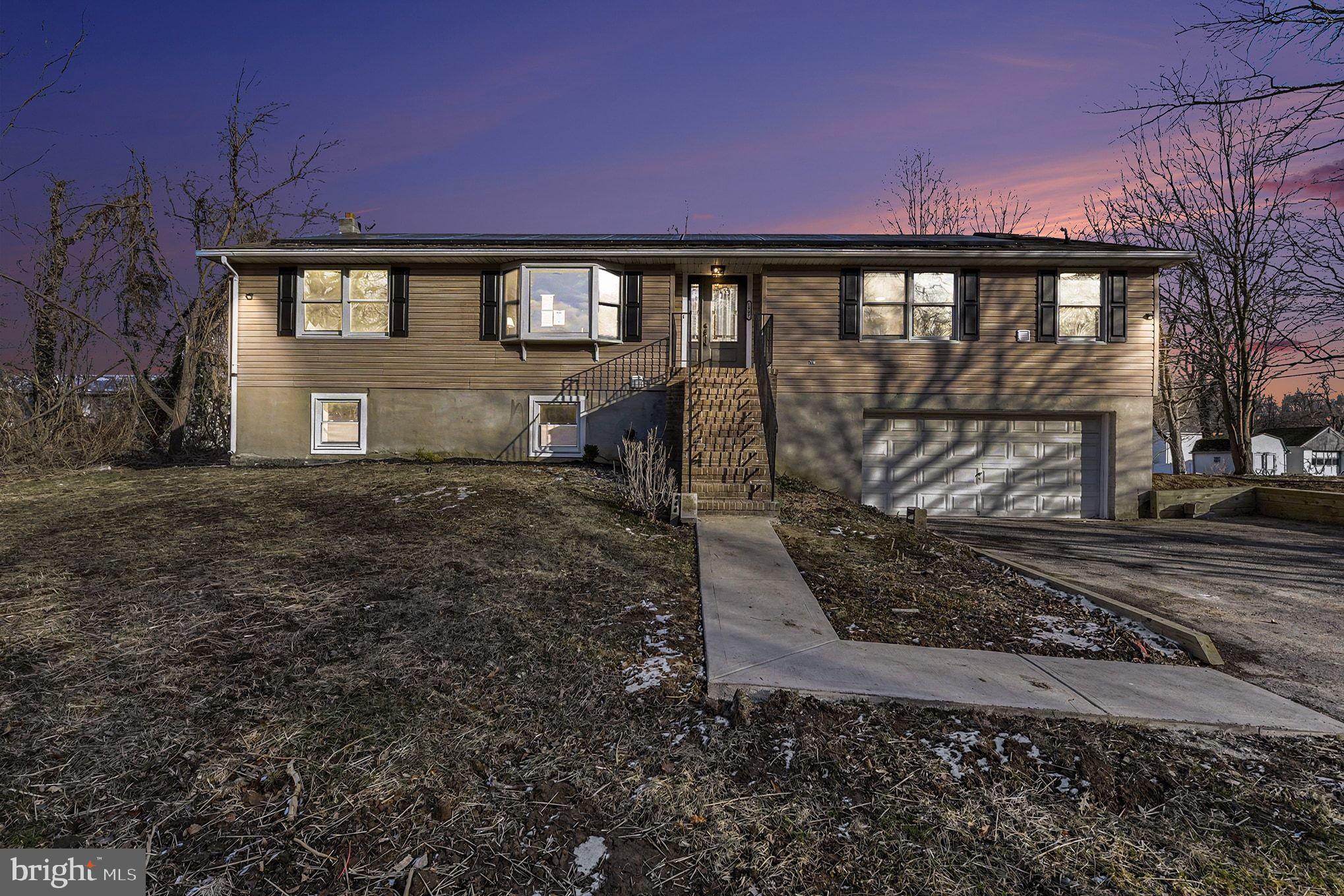 1009 Maple Road Essex, MD 21221 - Photo 2 of 26 a view of a house with a yard