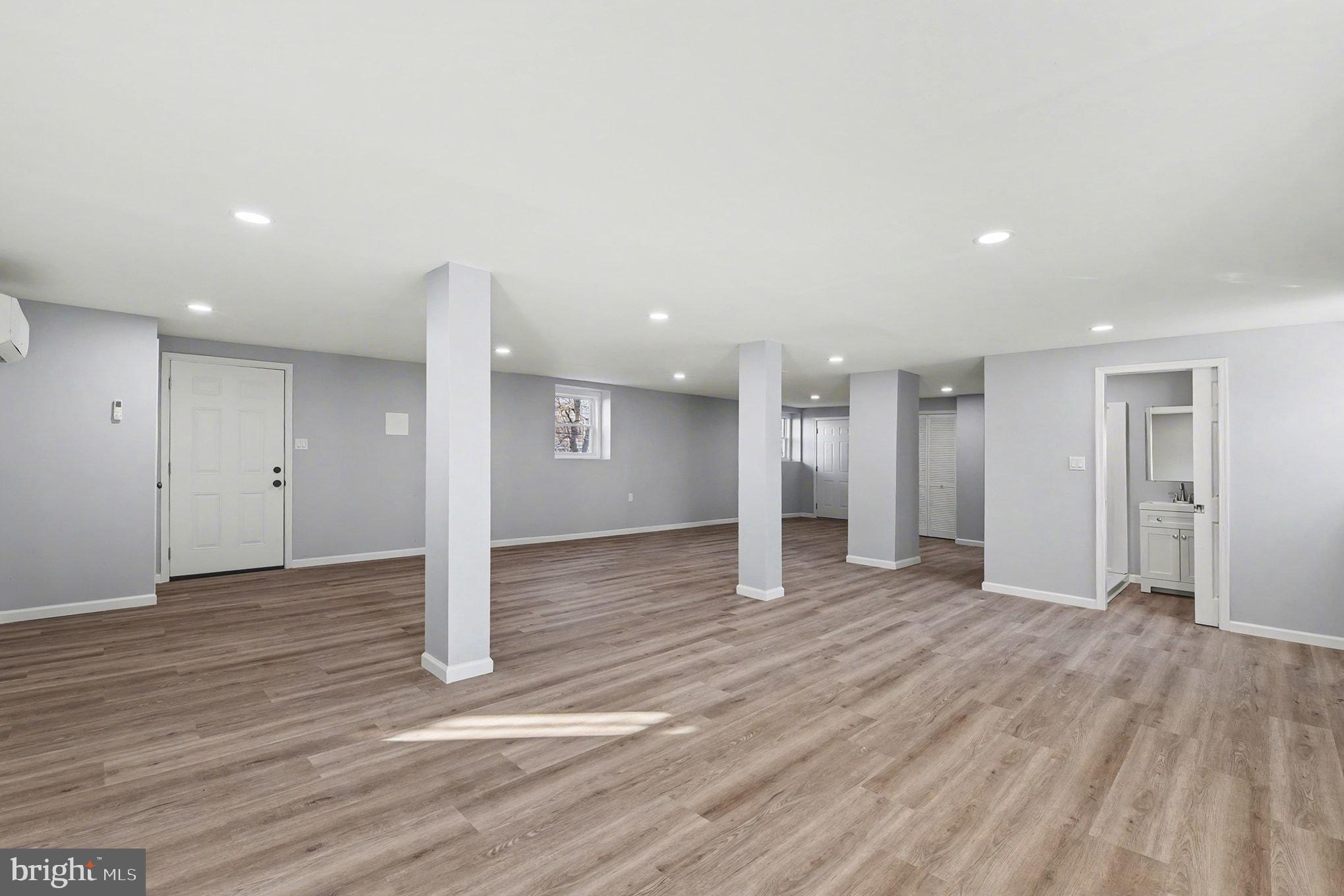 1009 Maple Road Essex, MD 21221 - Photo 21 of 26 a view of empty room with wooden floor