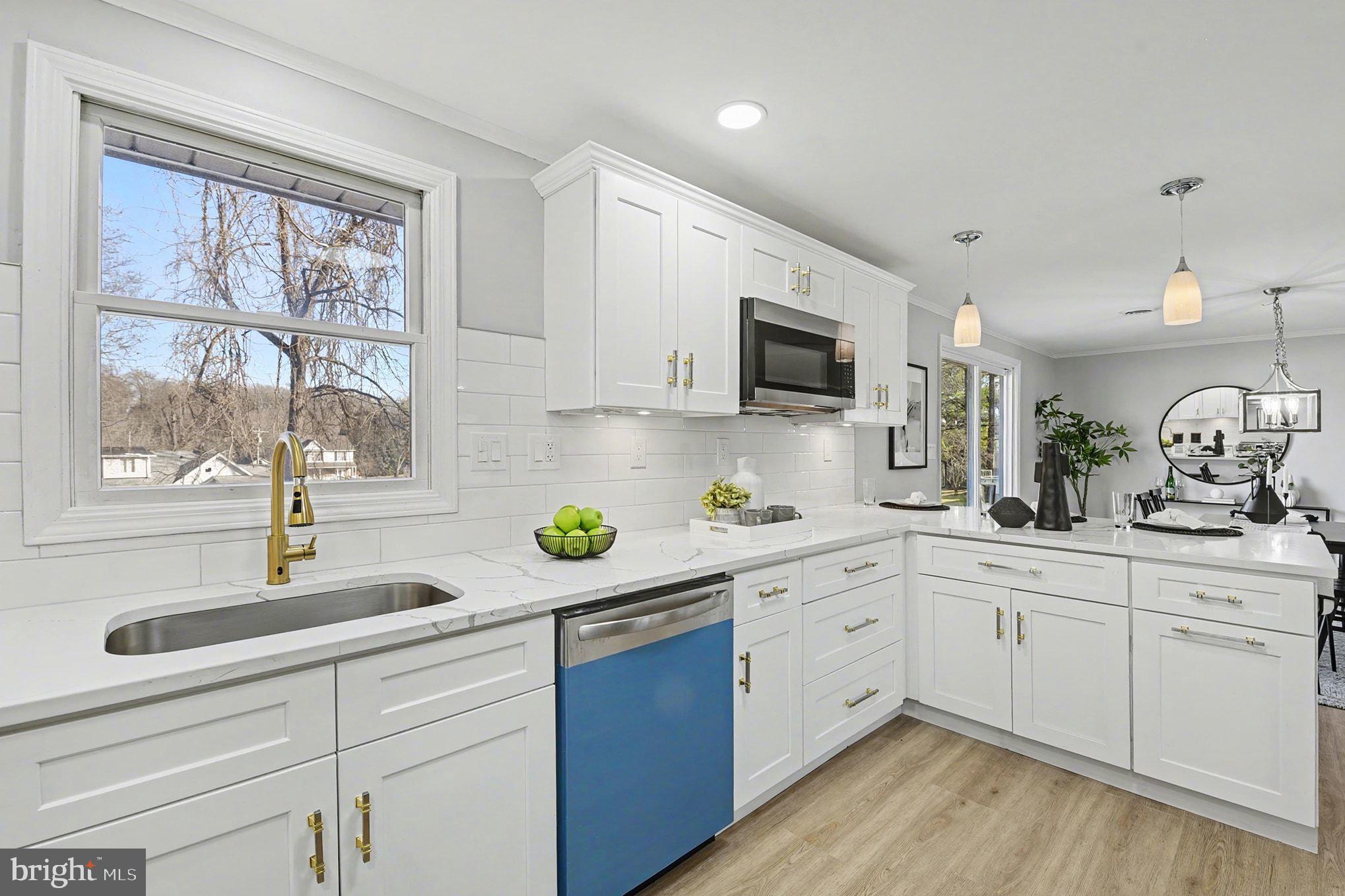 1009 Maple Road Essex, MD 21221 - Photo 5 of 26 a kitchen with sink a window and appliances