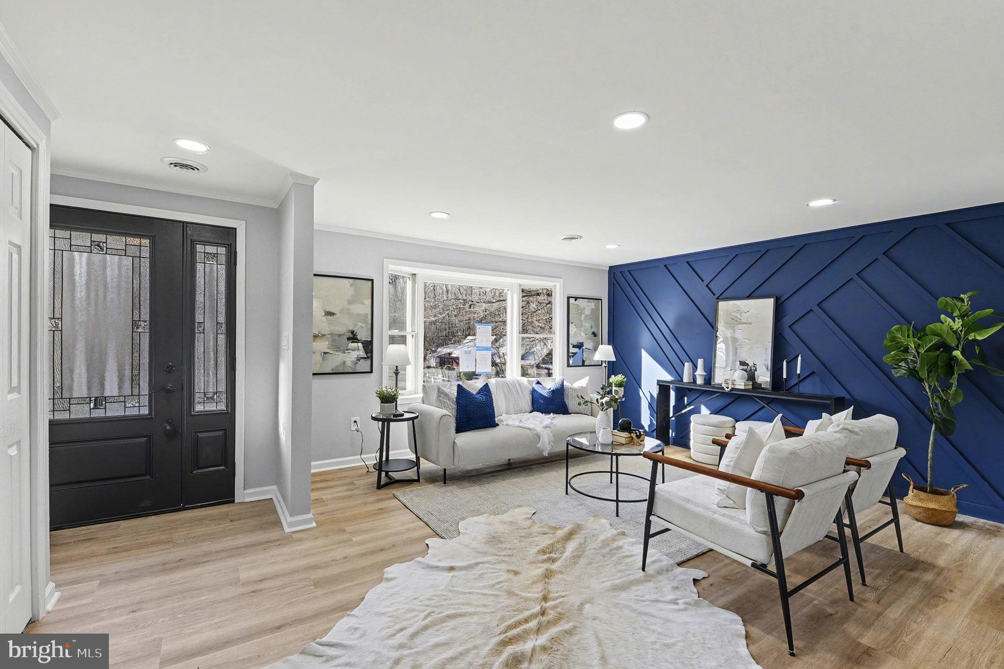 1009 Maple Road Essex, MD 21221 - Photo 10 of 26 a living room with furniture and a potted plant