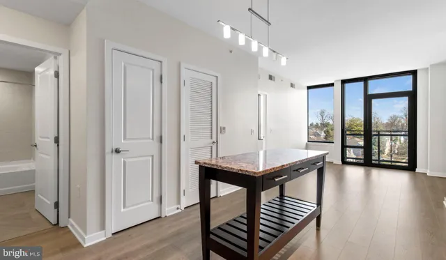 a view of an empty room and a window