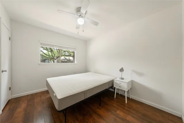 a bedroom with a bed and a table