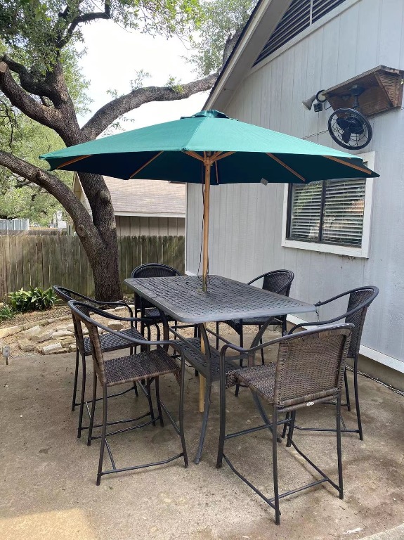 12900 Coridan Drive Austin, TX 78727 - Photo 15 of 16 a view of an outdoor space with a table and chairs