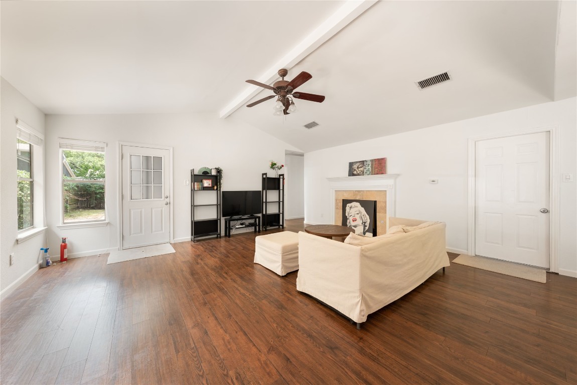 12900 Coridan Drive Austin, TX 78727 - Photo 2 of 16 a living room with furniture and a fireplace