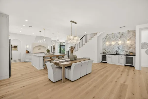 a spacious bedroom with a bed and a large window