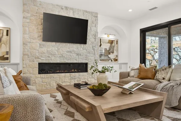 a living room with furniture and a flat screen tv