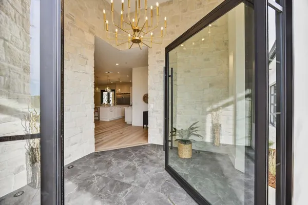 a kitchen with stainless steel appliances kitchen island a large island in the center and wooden floor