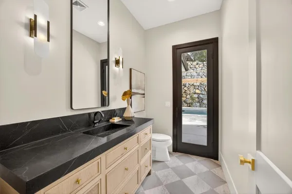 a bathroom with a sink and a mirror