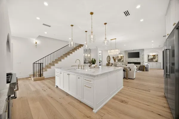 a stove top oven sitting inside of a kitchen