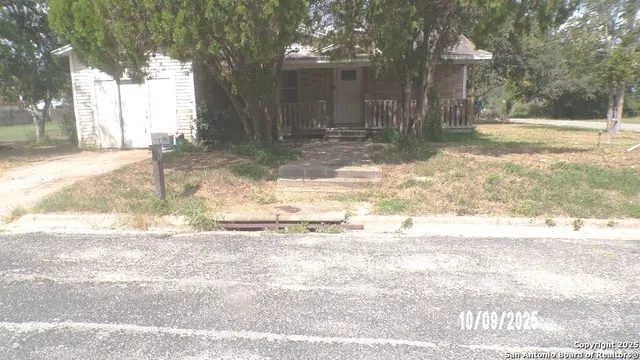 a view of a yard with trees