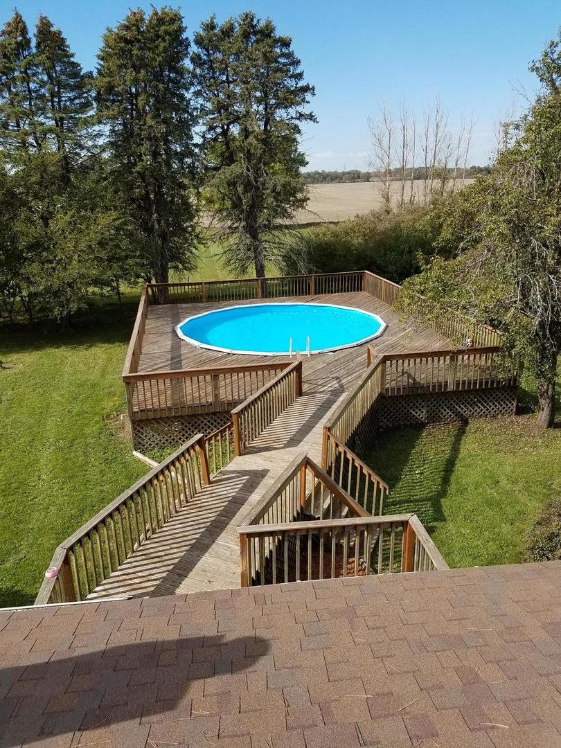 10481 Cherry Valley Road Genoa, IL 60135 - Photo 4 of 17 a view of swimming pool with a lounge chairs