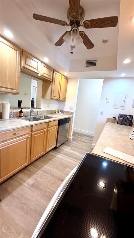 110 Northwest 70th Street, Unit 202 Boca Raton, FL 33487 - Photo 2 of 13 a kitchen with stainless steel appliances a sink dishwasher a stove a refrigerator with wooden cabinets and floor