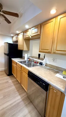 a kitchen with stainless steel appliances granite countertop a sink a stove and a microwave