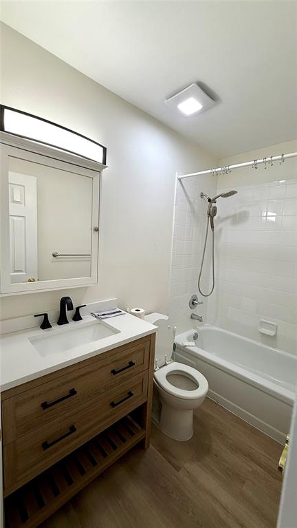 110 Northwest 70th Street, Unit 202 Boca Raton, FL 33487 - Photo 6 of 13 a bathroom with a granite countertop toilet a sink and a mirror
