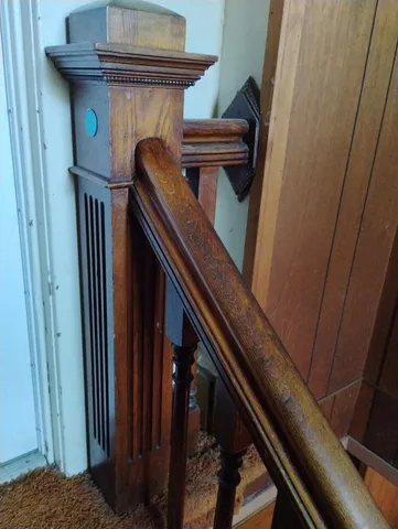 a view of entryway with wooden floor and stairs