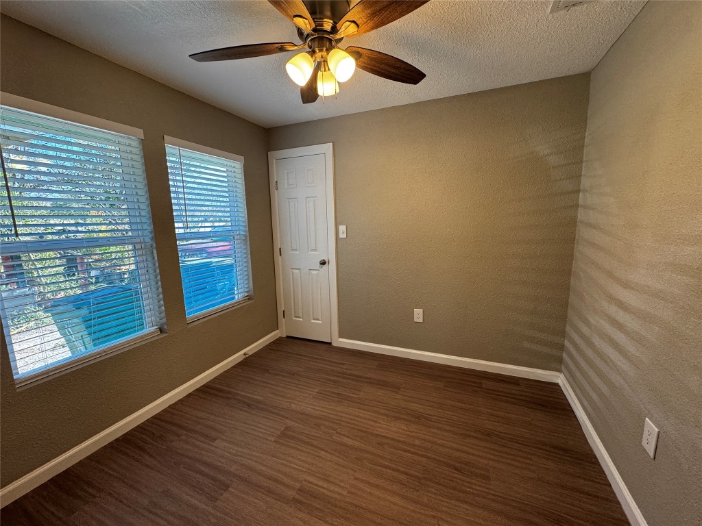 206 West N Loop Boulevard Austin, TX 78751 - Photo 5 of 11 wooden floor in an empty room with a window