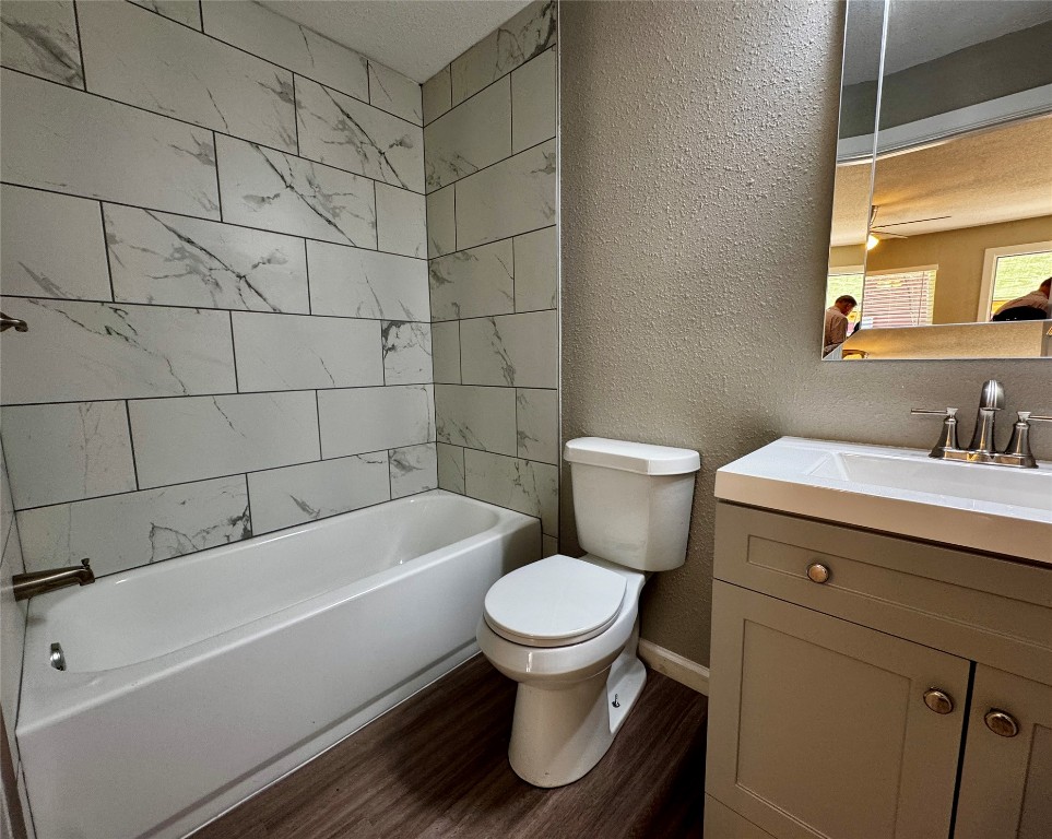 206 West N Loop Boulevard Austin, TX 78751 - Photo 6 of 11 a bathroom with a sink and a toilet