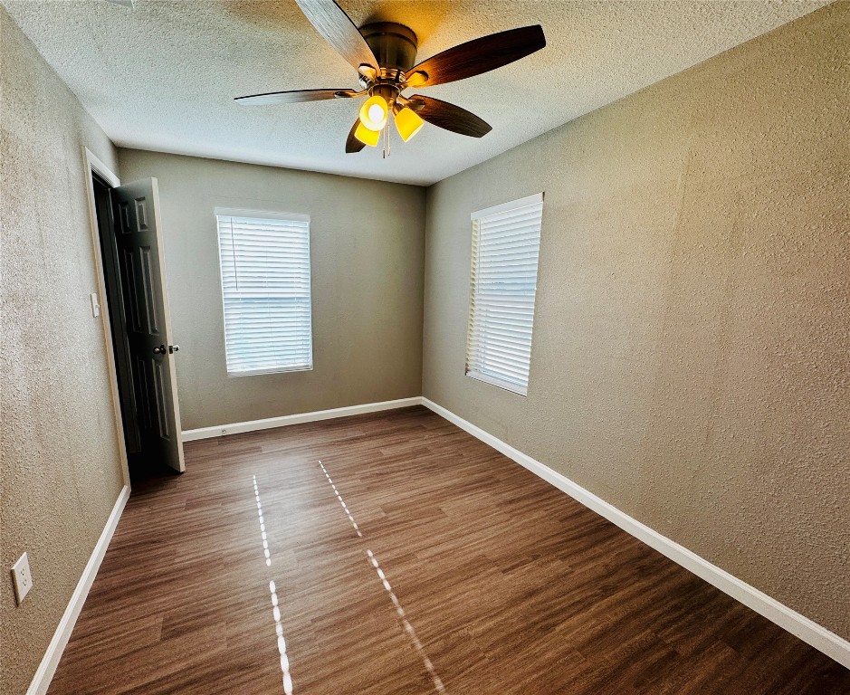 206 West N Loop Boulevard Austin, TX 78751 - Photo 7 of 11 a view of an empty room with window and chandelier fan