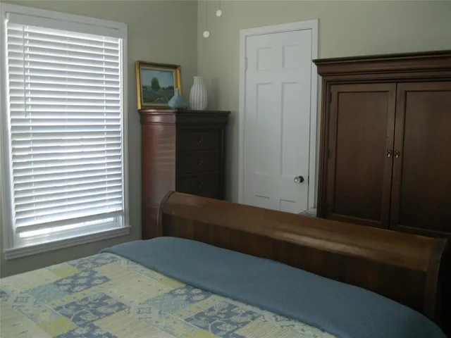 a bedroom with a bed and furniture