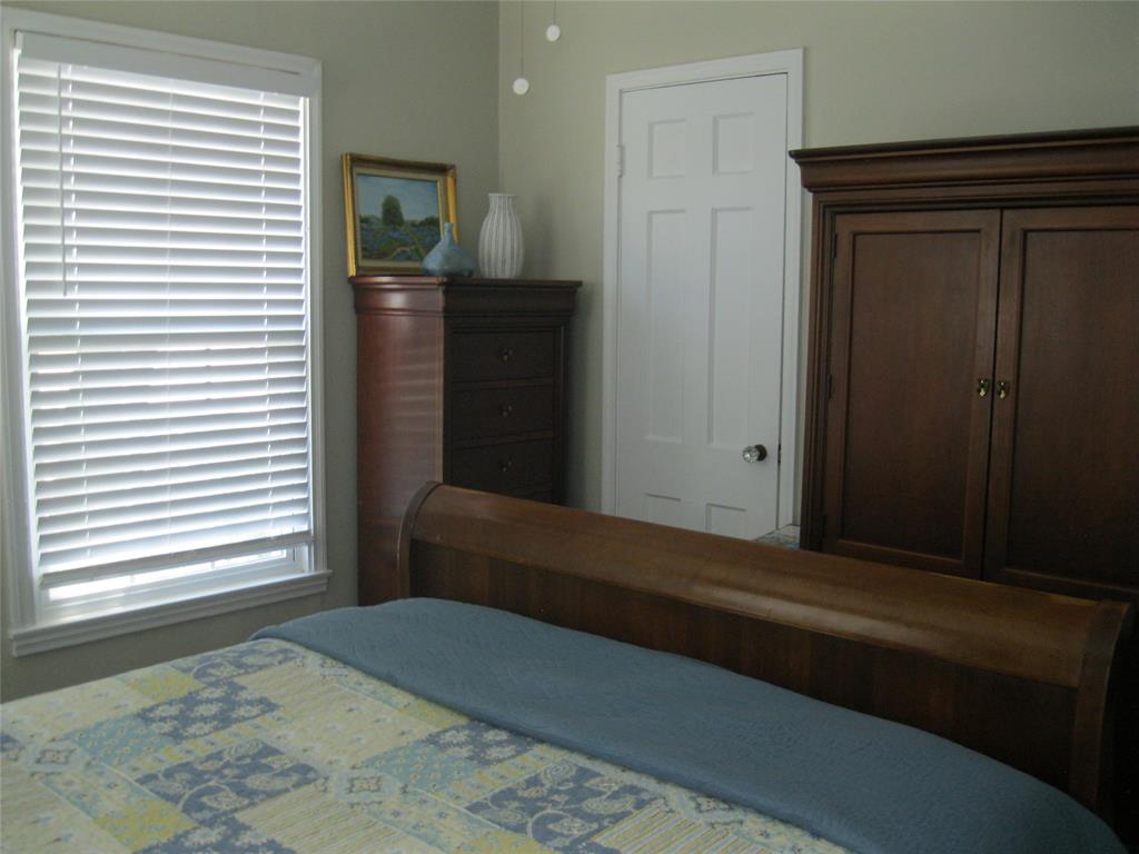 1302 West Wheeler Street Breckenridge, TX 76424 - Photo 31 of 40 a bedroom with a bed and a window