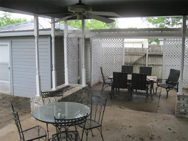 a view of balcony with wooden fence