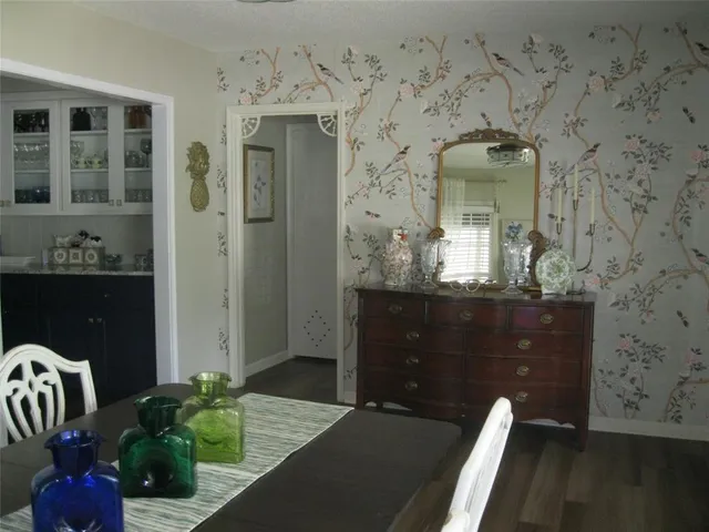 a bathroom with a granite countertop sink and a window