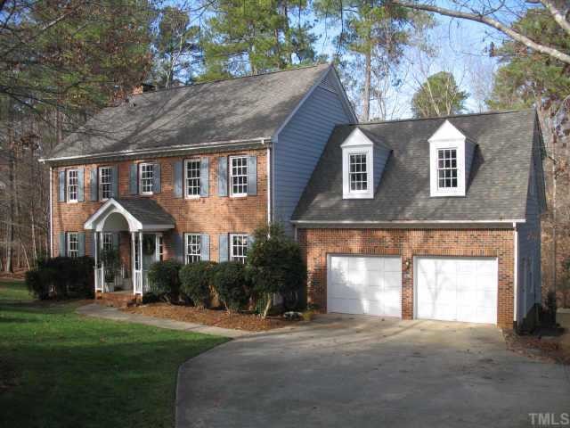 1405 Bascomb Drive Raleigh, NC 27614 - Photo 1 of 12 a front view of a house with a yard and garage