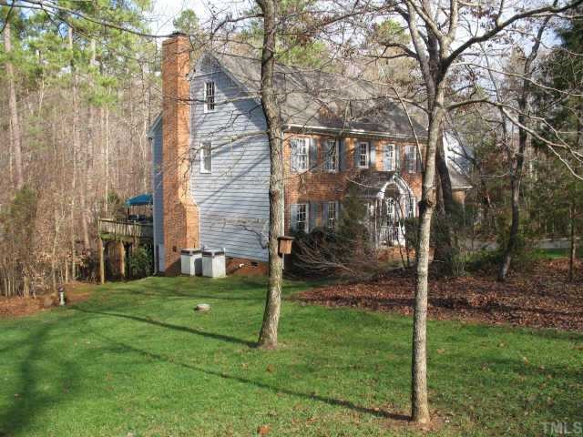 1405 Bascomb Drive Raleigh, NC 27614 - Photo 12 of 12 a backyard of a house with lots of green space