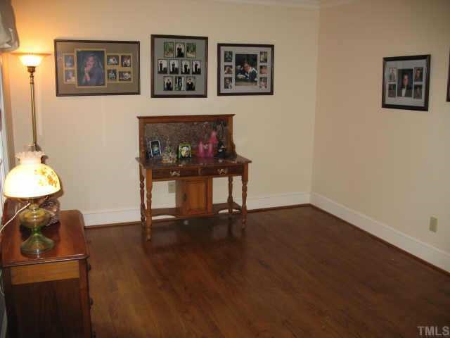 1405 Bascomb Drive Raleigh, NC 27614 - Photo 2 of 12 a view of a workspace with wooden floor
