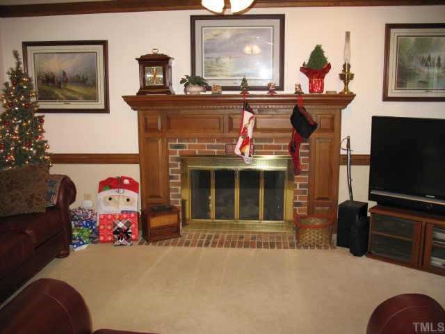 1405 Bascomb Drive Raleigh, NC 27614 - Photo 4 of 12 a living room with furniture and a flat screen tv
