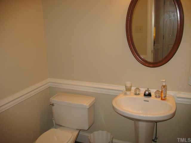 1405 Bascomb Drive Raleigh, NC 27614 - Photo 7 of 12 a bathroom with a sink and a mirror