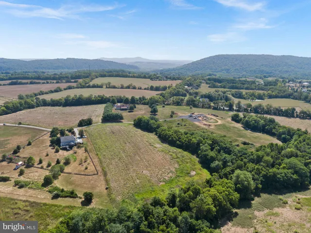 an aerial view of a house with a garden