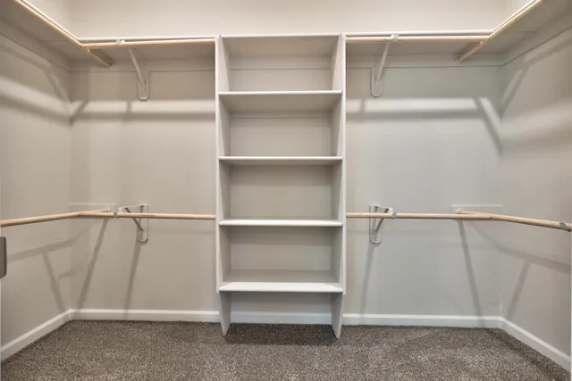 a view of an empty walk in closet