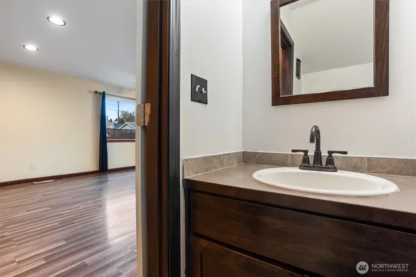 a bathroom with a sink and a mirror