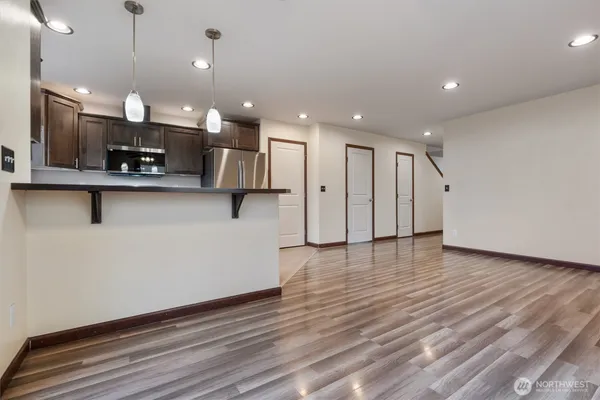 a view of kitchen with stainless steel appliances refrigerator oven and stove