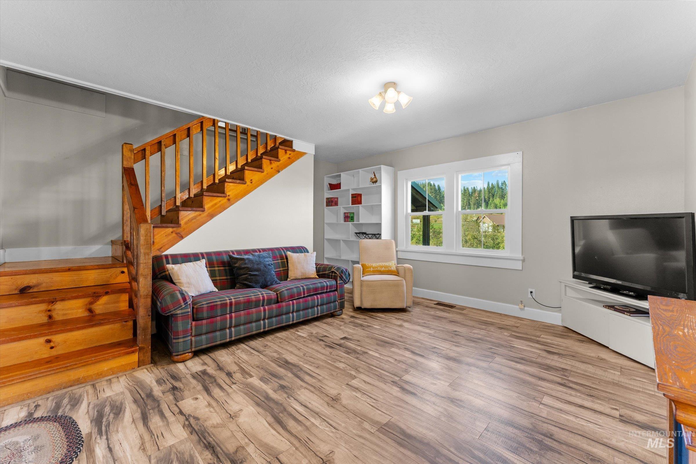 315 South Middlefork Road Garden Valley, ID 83622 - Photo 28 of 49 Living room featuring stairs and wood finished floors