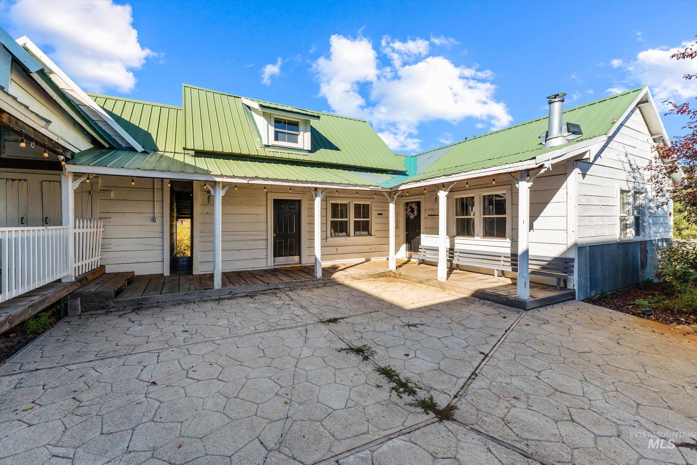 315 South Middlefork Road Garden Valley, ID 83622 - Photo 48 of 49 Back of house with a metal roof and a patio